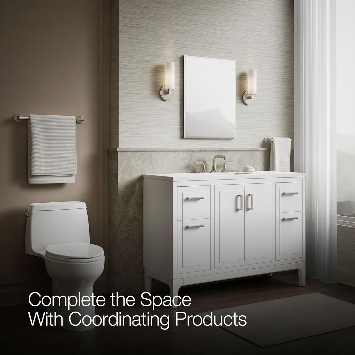 Closed rectangular mirrored cabinet centered above a white freestanding vanity, lit by sconces and daylight from a sheer