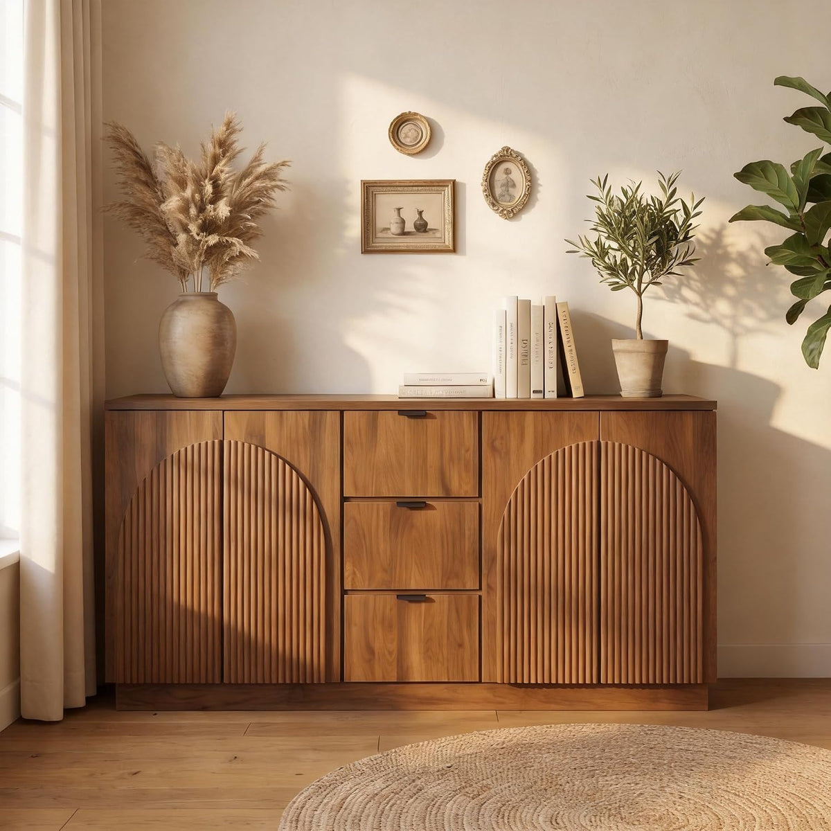 Straight-on front view of walnut sideboard with centered drawer tower and arched fluted doors