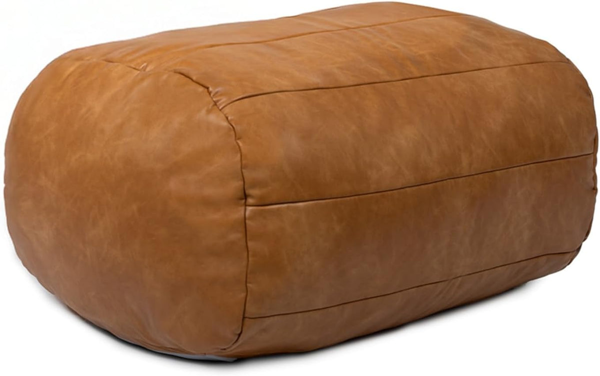 Tan vegan leather ottoman, angled side view showing stitched paneling