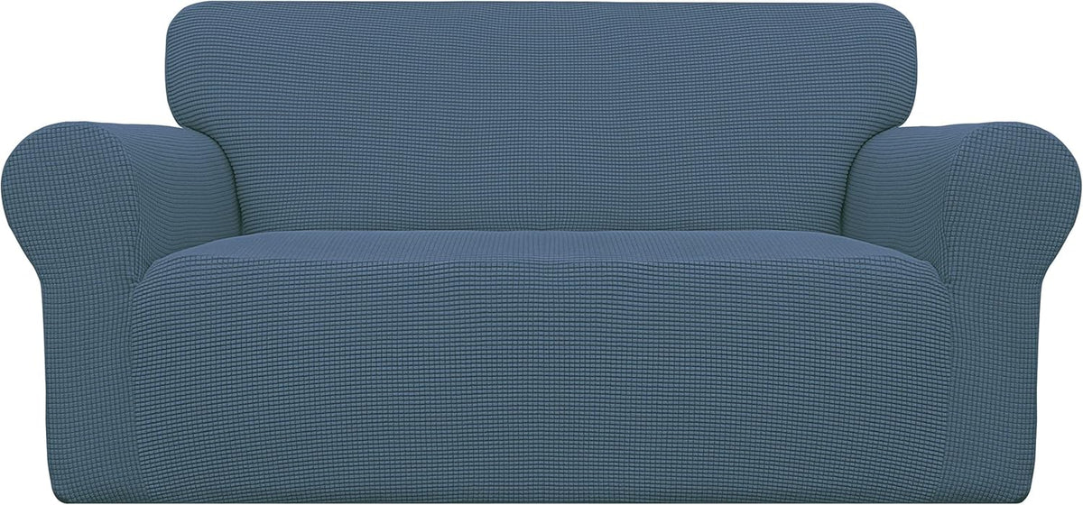 Front-facing image of a blue textured loveseat cover with rounded arms and a smooth seat surface.