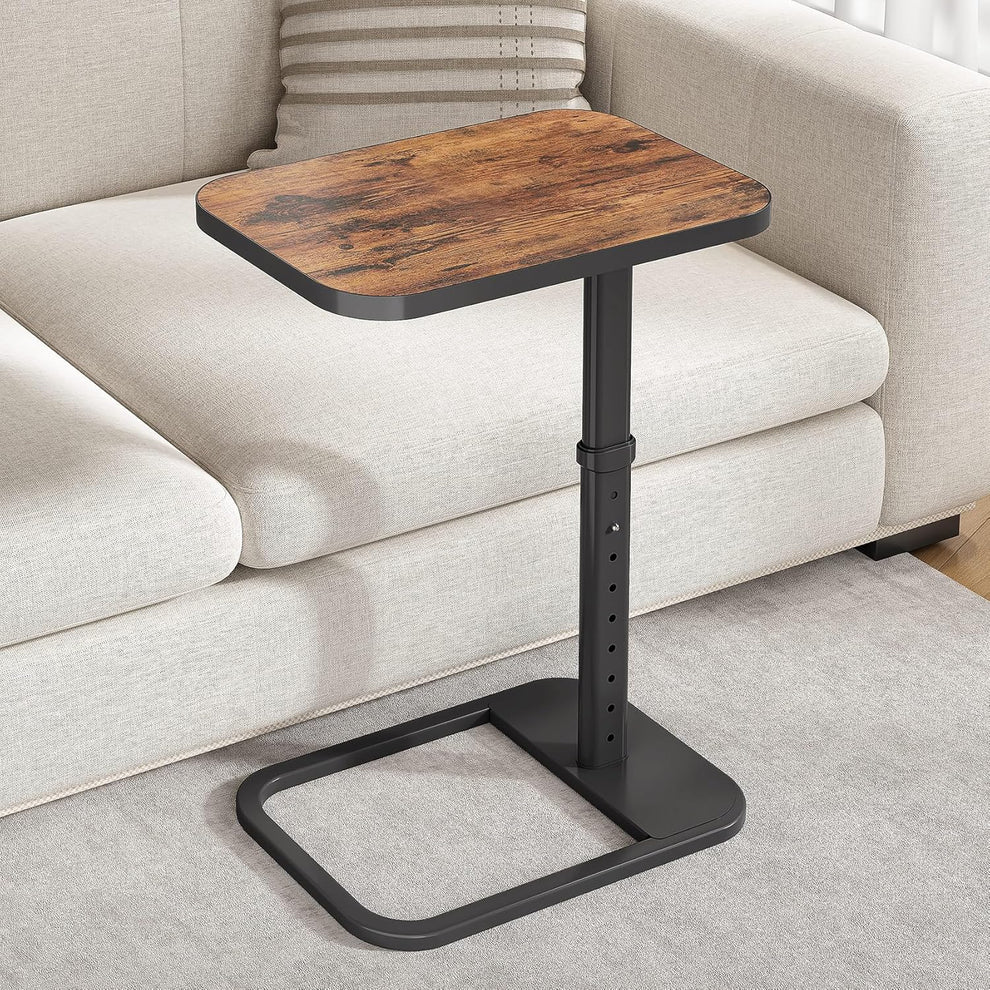 C-shaped snack table with wood tabletop and black metal base positioned beside a light fabric sofa.