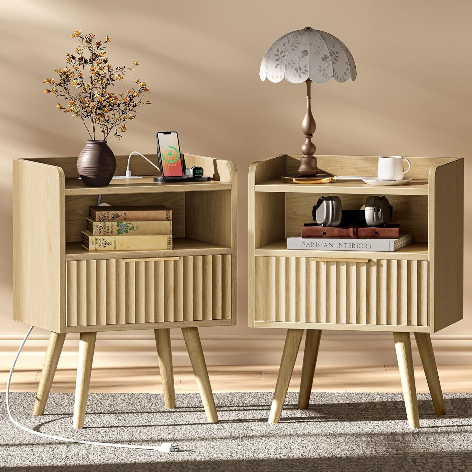 Two matching light walnut fluted nightstands displayed side by side with lamps and decor.