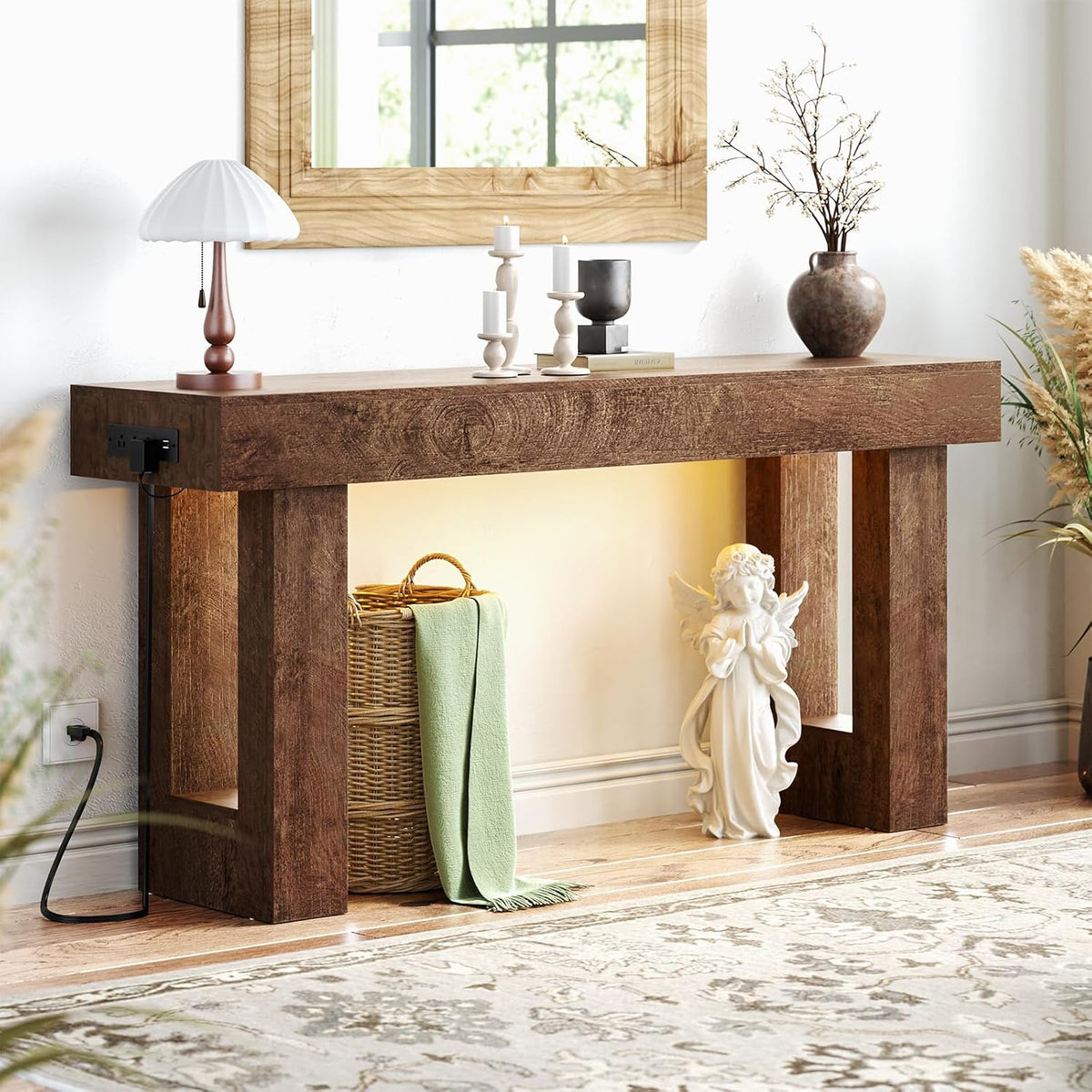 Low-angle view showing the console's thick wood legs, textured tabletop, and power cord running to the wall outlet.