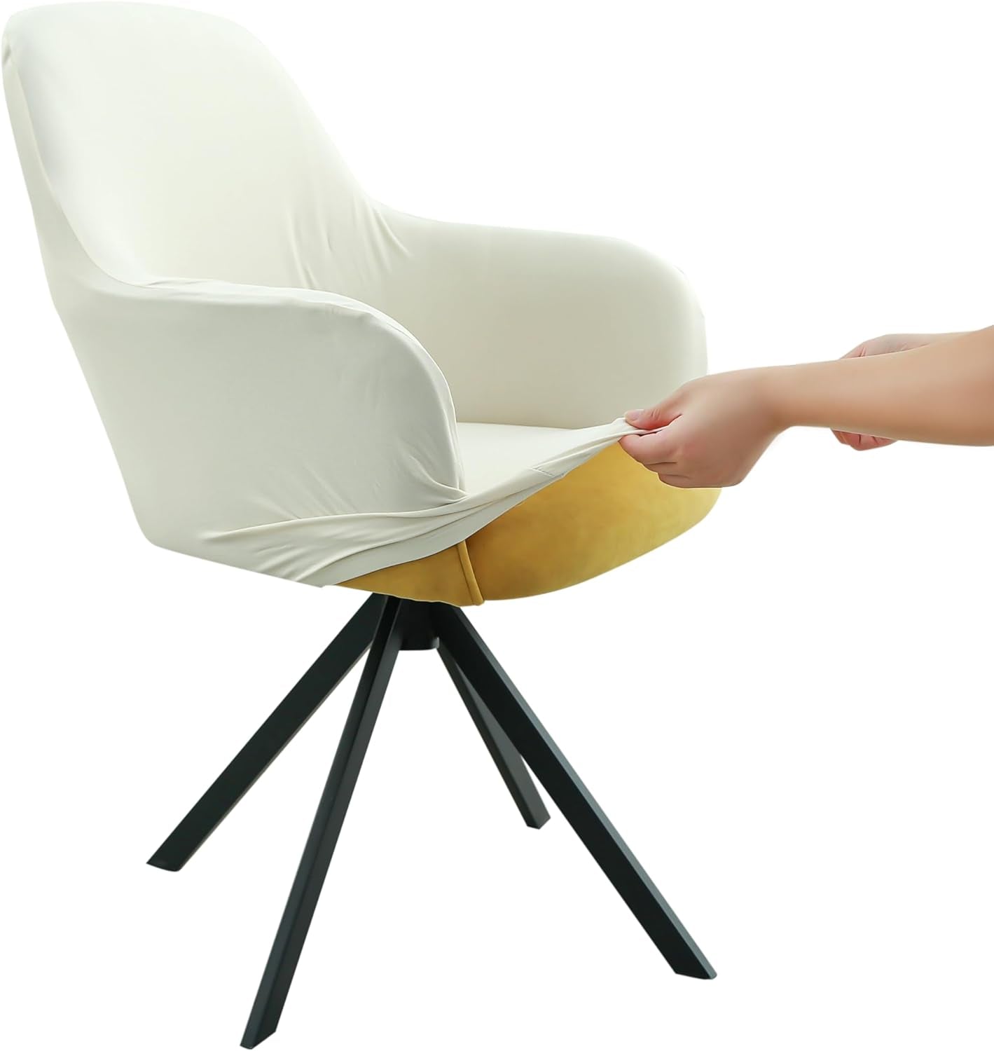 Close-up of a white stretch slipcover being pulled over the front edge of a mid-back armchair