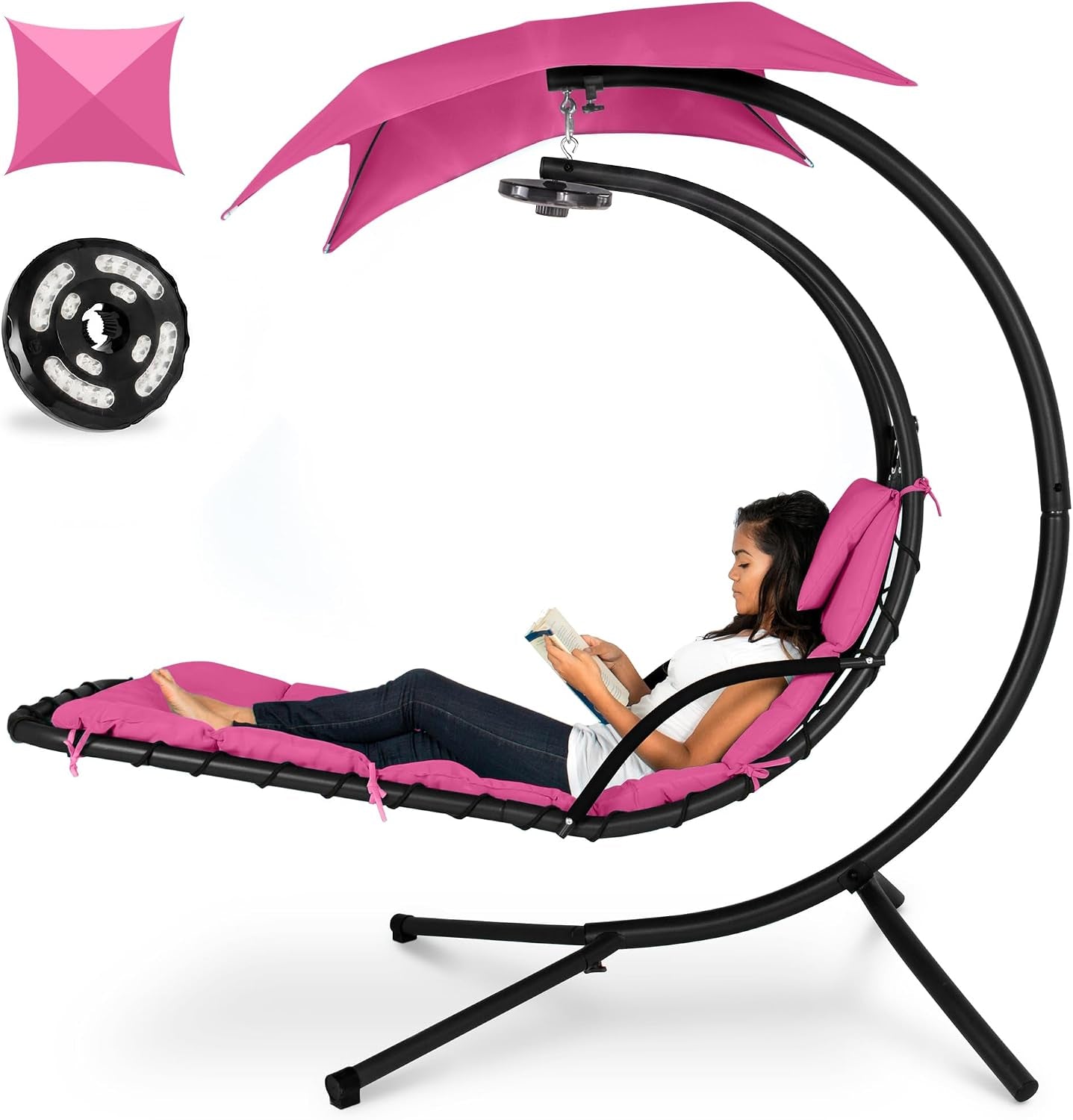 Curved hanging chaise with pink cushions and black frame, inset shows a round LED light accessory near the canopy.