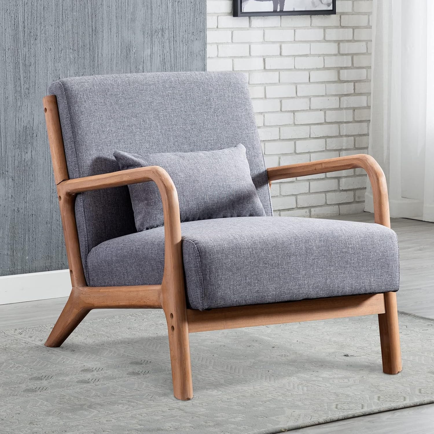Angled view of a single light gray fabric chair showing slatted wooden arm supports and cushion.