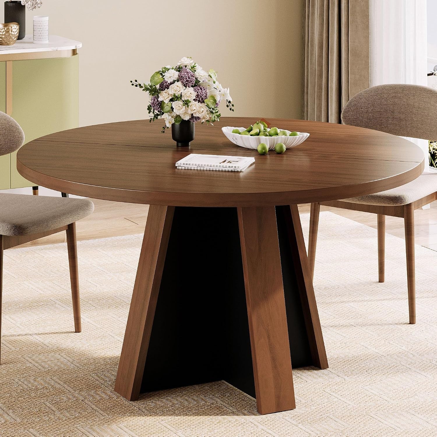Round dark-brown dining table with flared pedestal base and vase of flowers on top