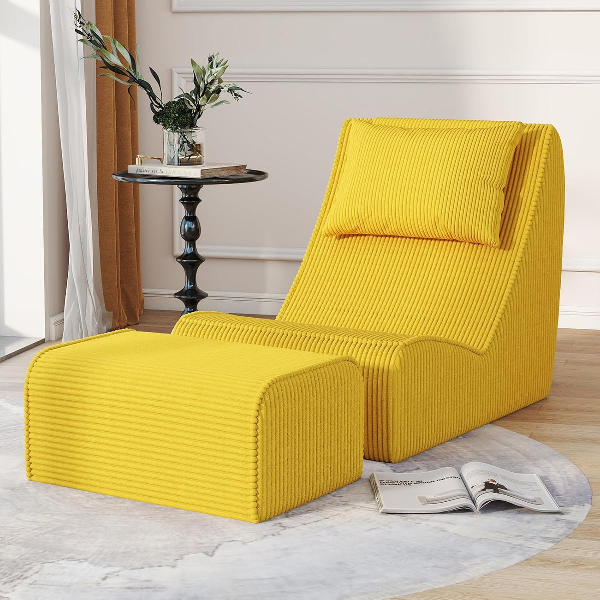 Vibrant yellow chaise lounge and ottoman on a round pale rug next to a black side table and an open magazine.
