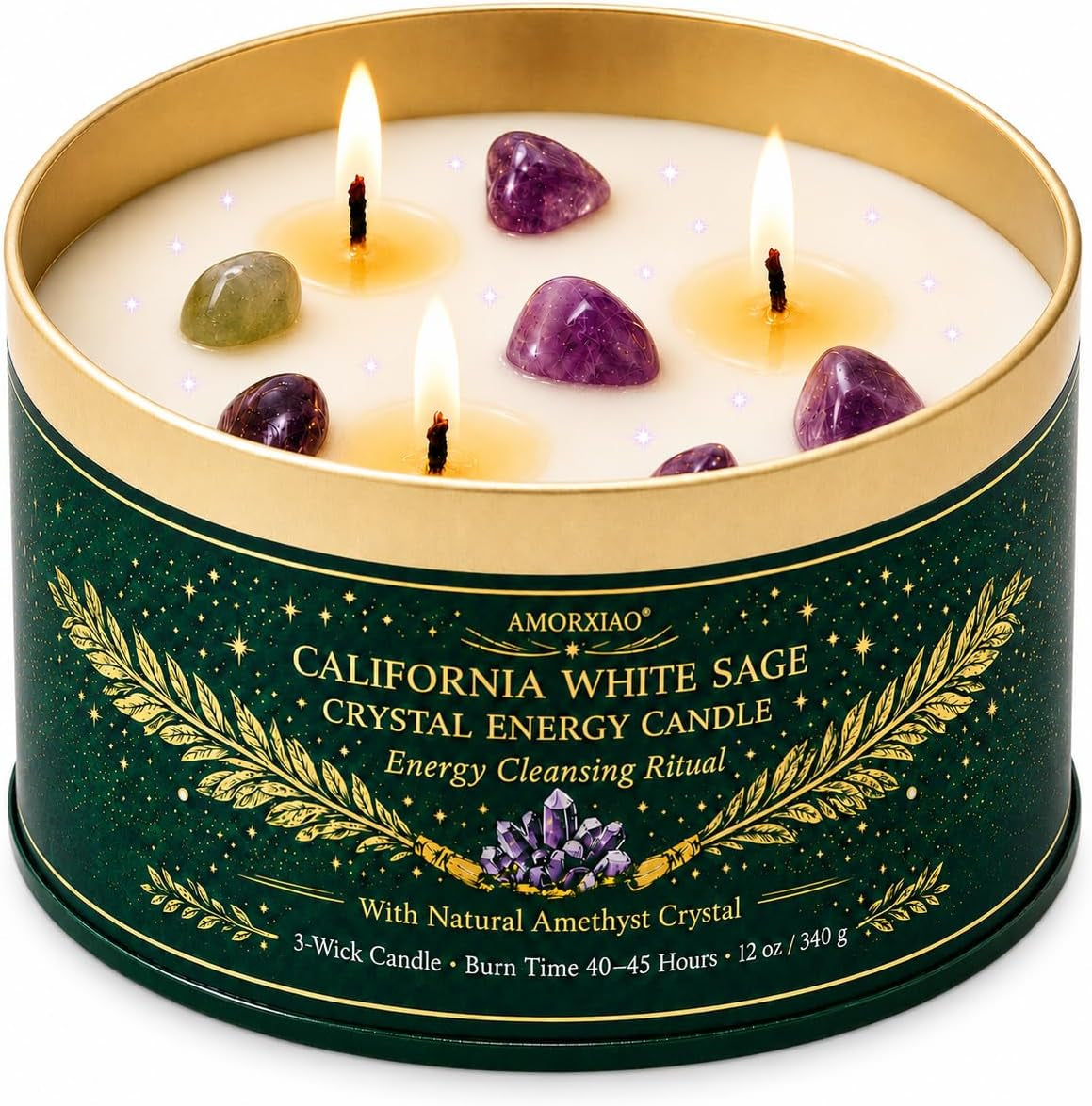 Close-up top view of a three-wick candle with small amethyst and green crystals set in the wax, flames lit