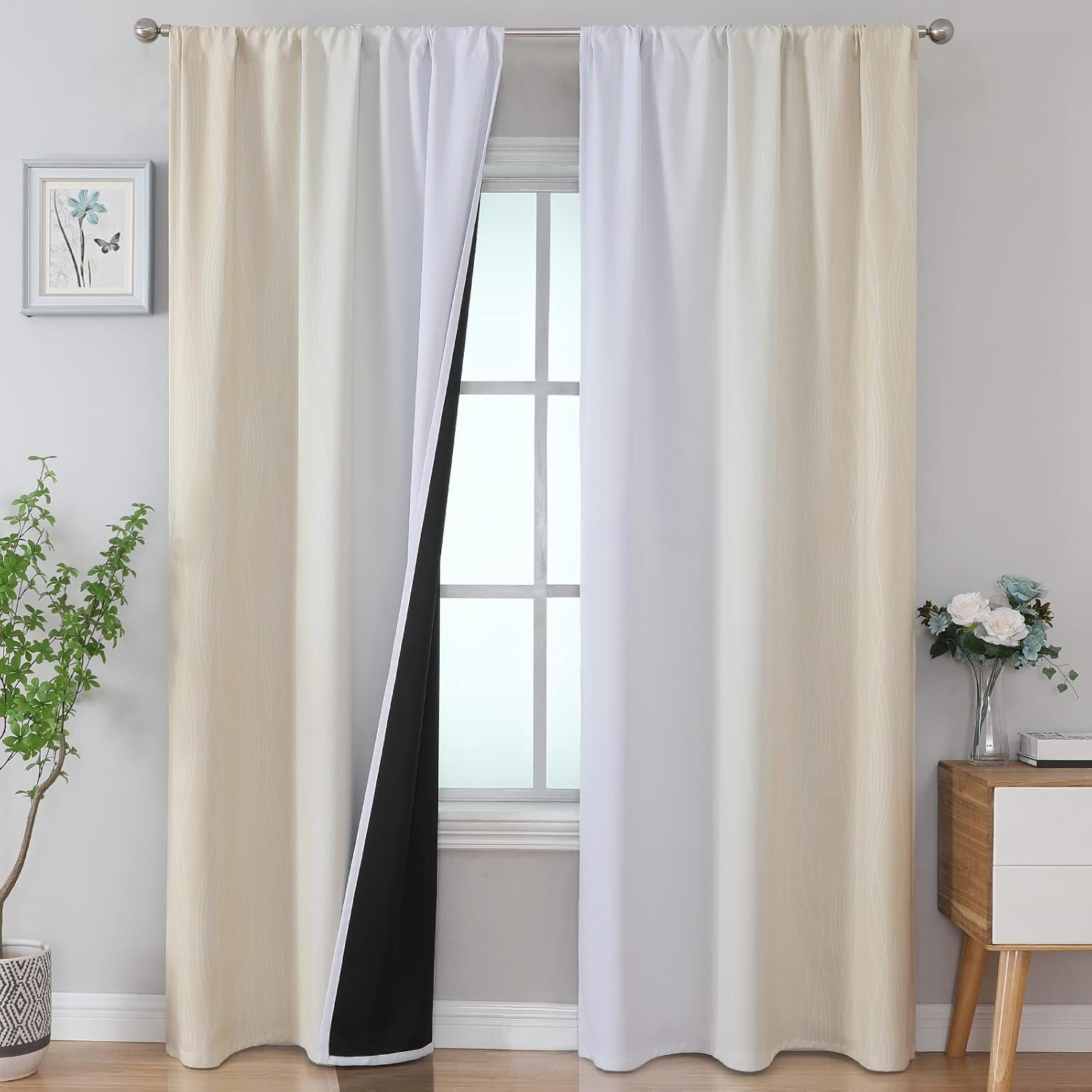 Full window view with cream and white ombre curtains, center panel pulled back to expose black-lined interior and soft