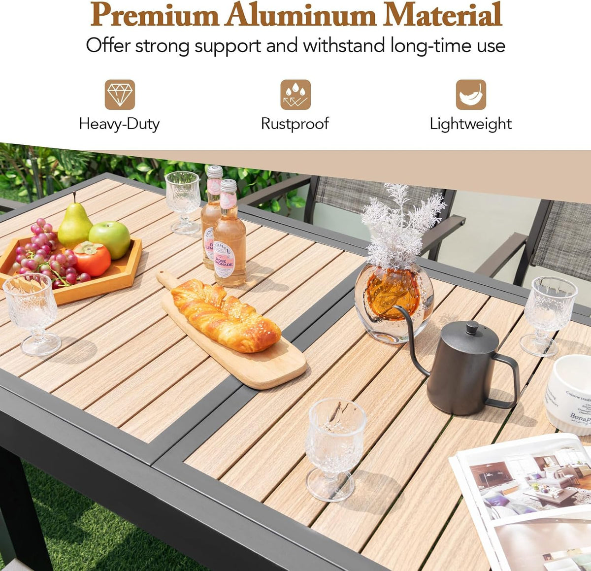 Close-up of slatted wood-like tabletop panels and dark gray aluminum frame with tableware and drinks on top