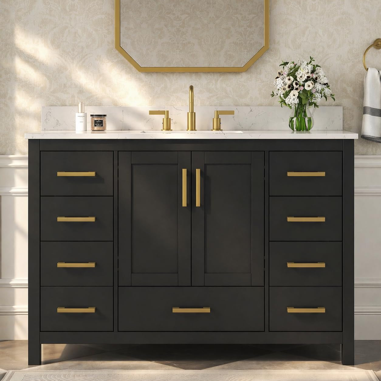 Front view of a wide black vanity with central double doors, multiple side drawers and gold pulls.