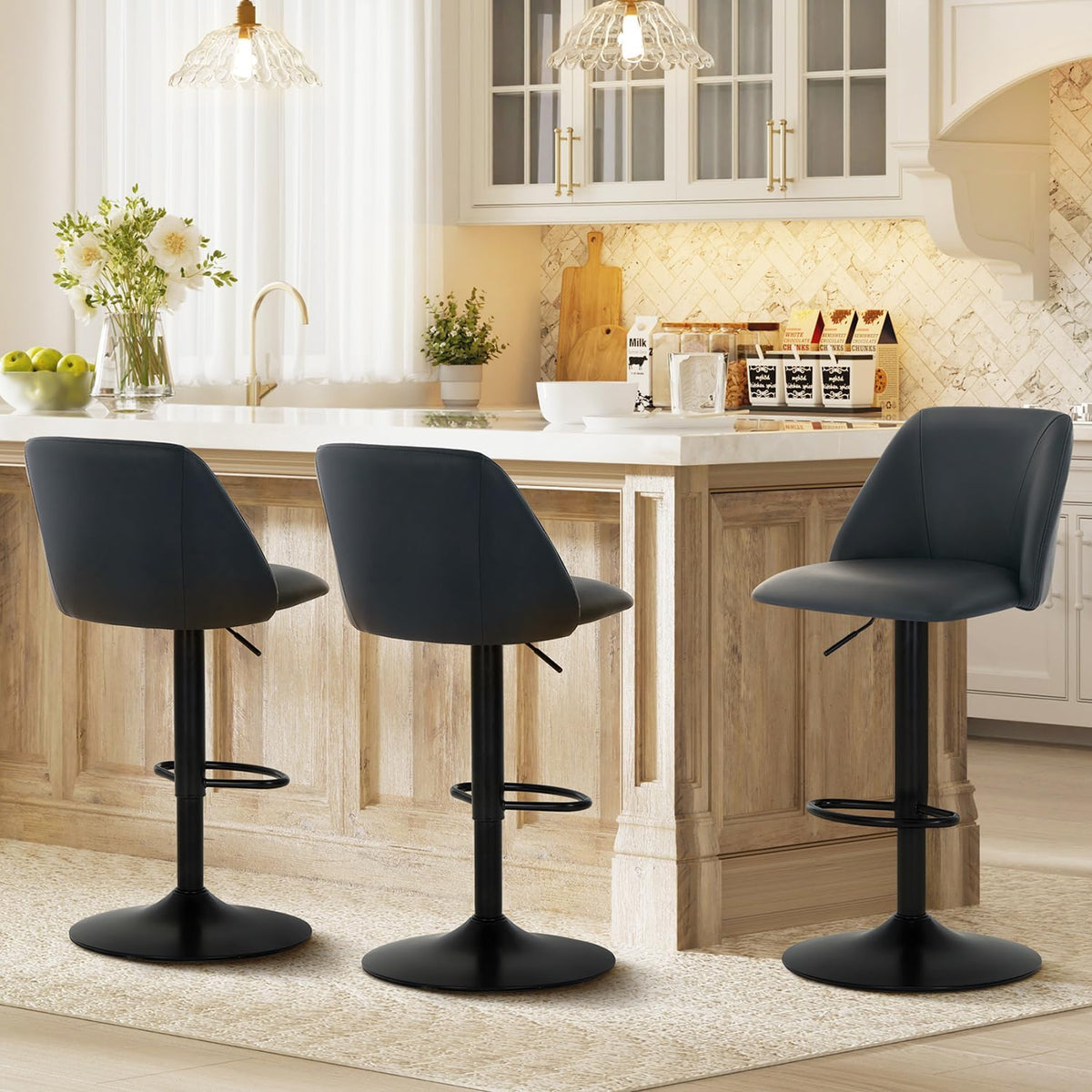 Three dark charcoal swivel bar stools shown from the side with visible footrests and pedestal bases