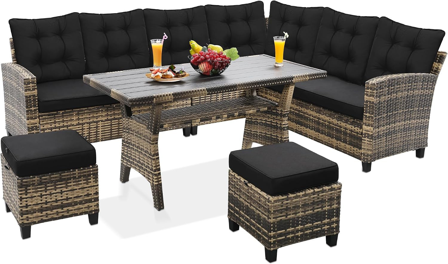 Corner sectional with two ottomans and a rectangular dining-style table topped with fruit and drinks.