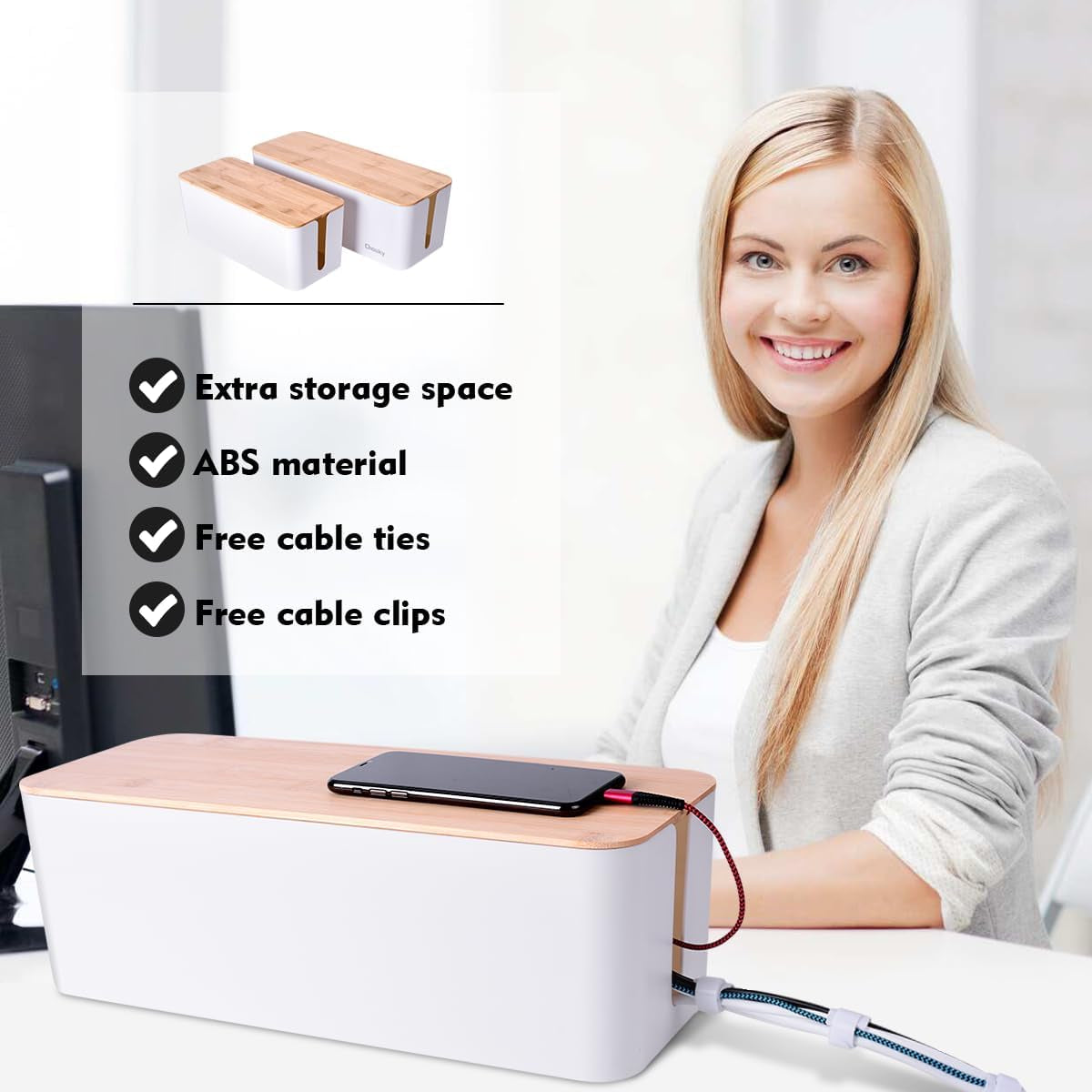 White cable management box with bamboo lid on a desk with a woman smiling in the background and cords routed through a side‑g