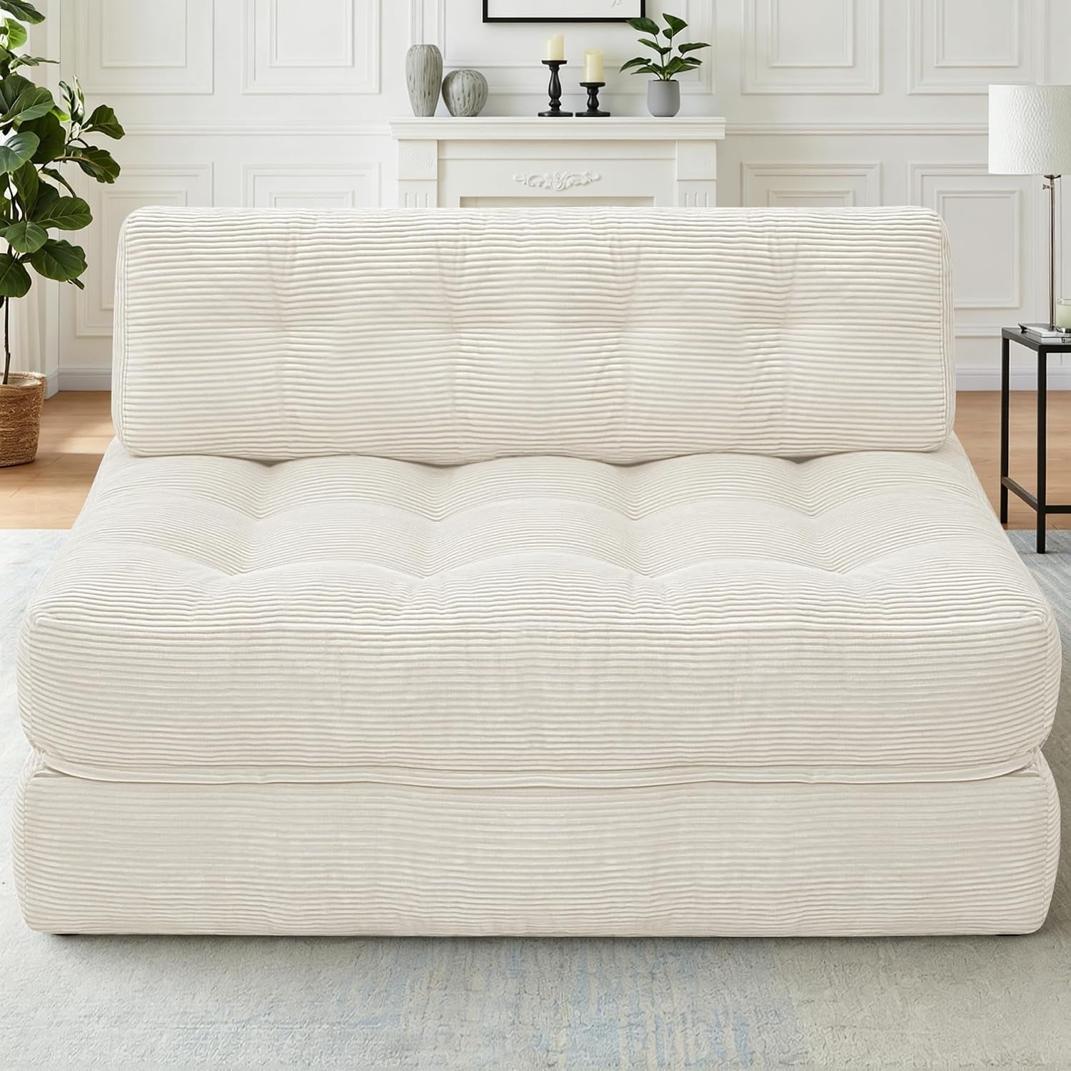 Front-facing view of a single corduroy foldable sofa chair in a soft cream color against a white wall.