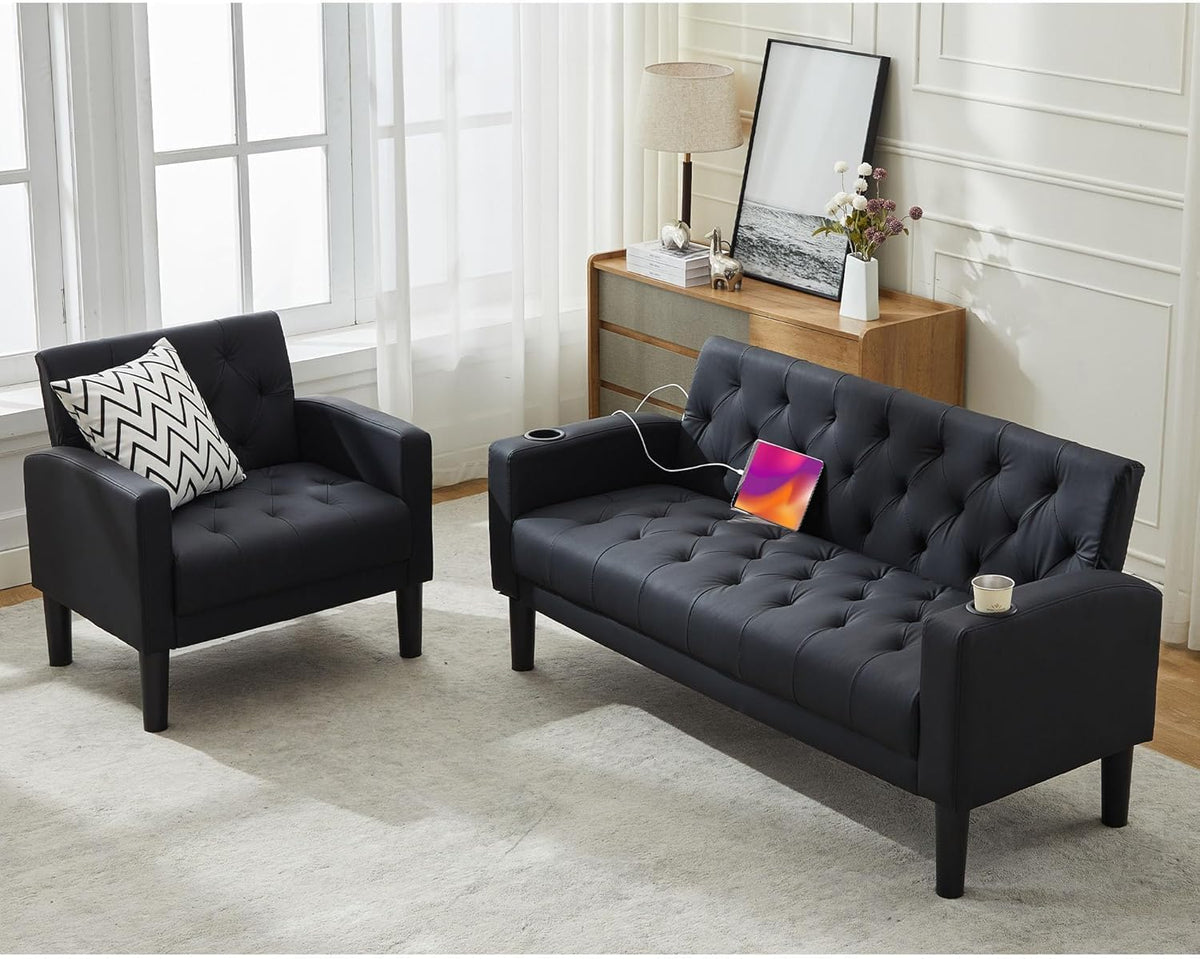 Angled view of black loveseat and single armchair, chevron throw pillow on the chair and a cup in the loveseat armrest.