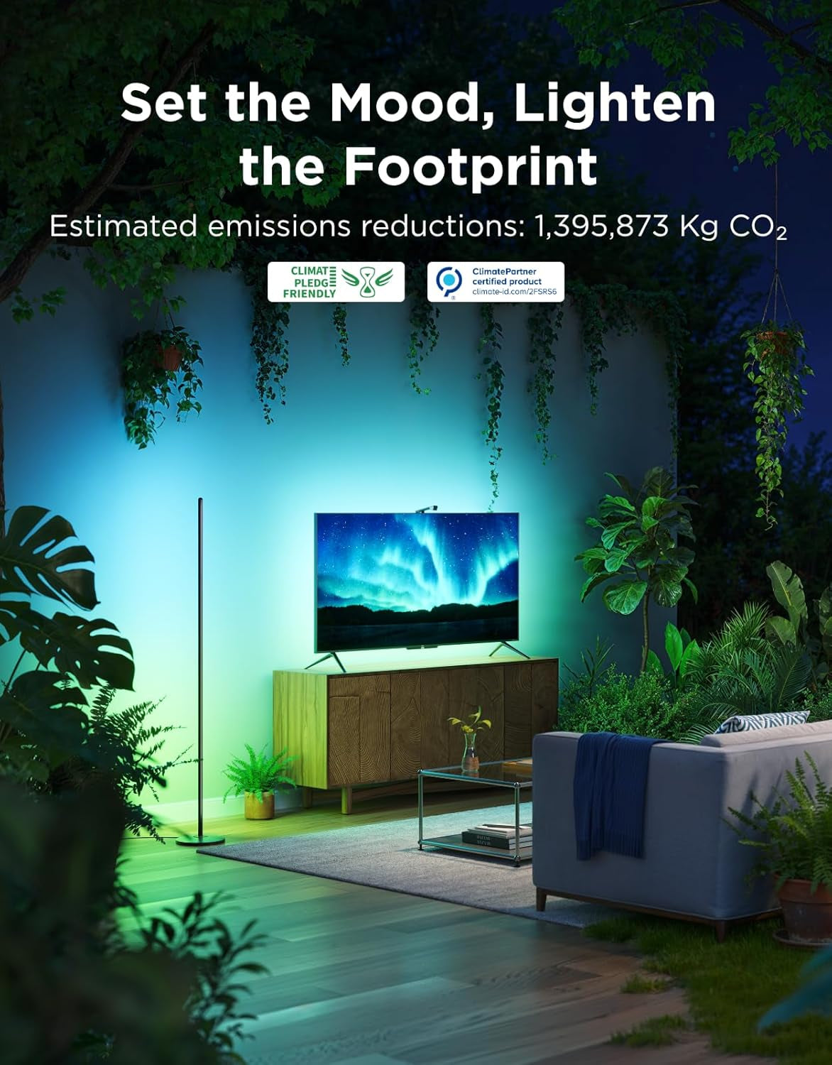 Slim floor lamp casting green ambient light behind a TV in a leafy living room scene