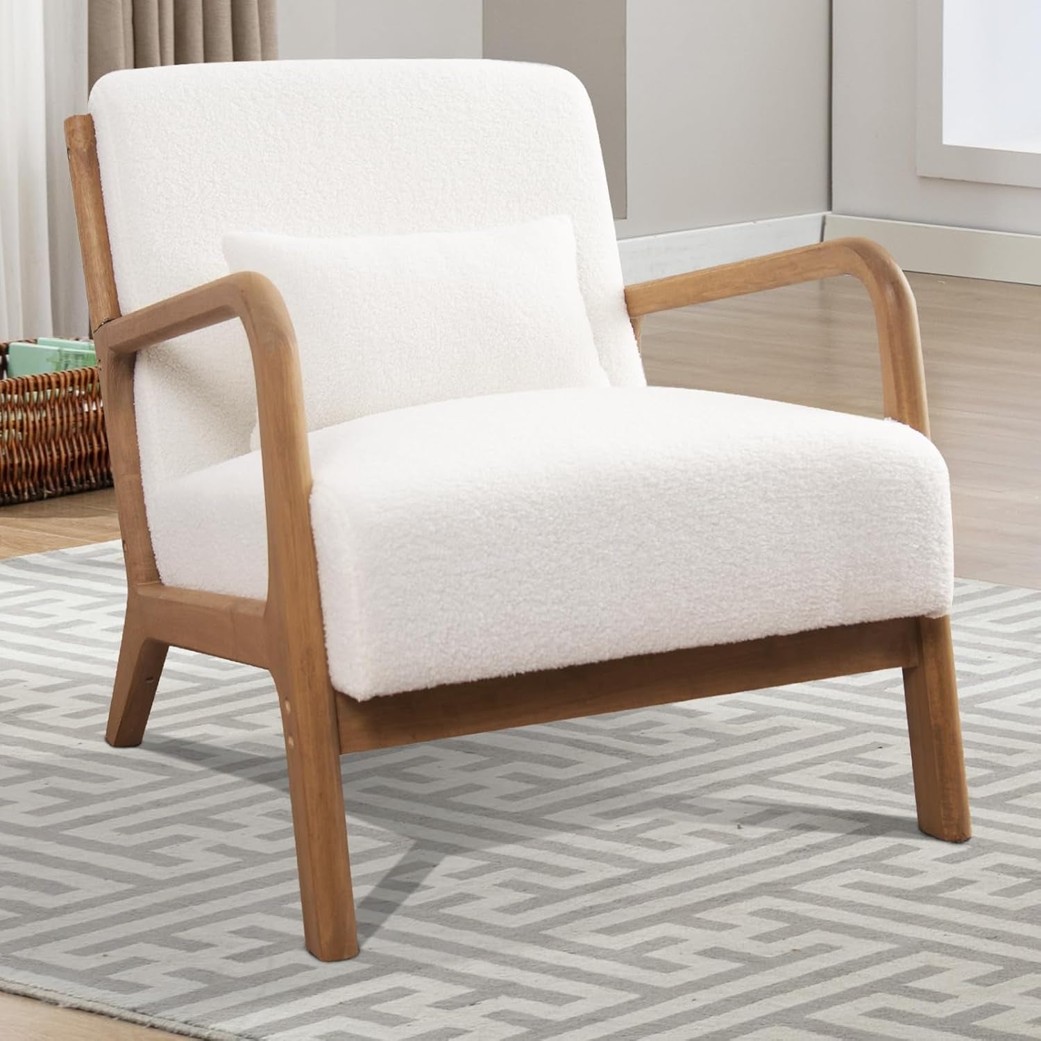 Creamy white bouclé accent chair showing textured fabric, wooden legs and matching lumbar pillow