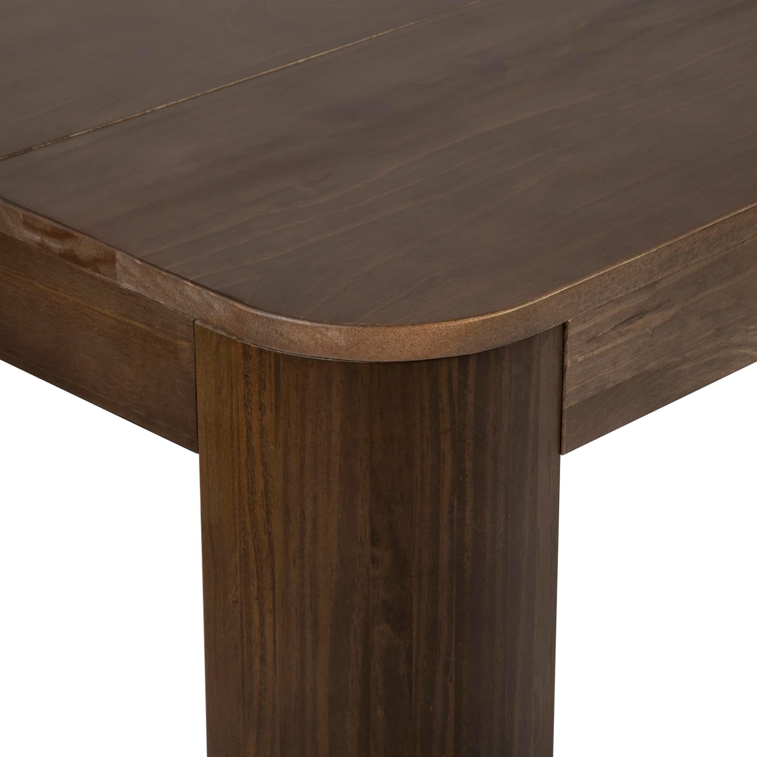 Close-up of tabletop corner and rounded leg showing wood grain and finished edge