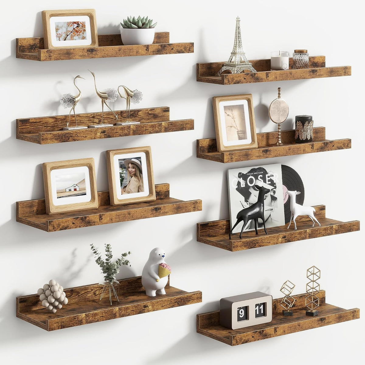 Six rustic brown floating ledges arranged in a staggered grid holding frames, sculptures, and a flip clock.