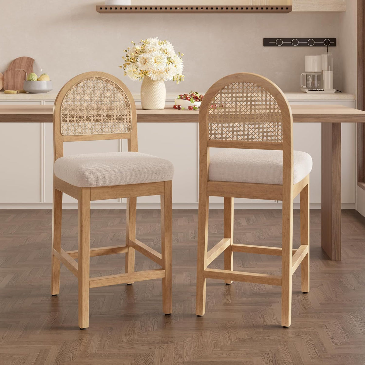 Two light-wood counter stools shown from behind at a kitchen island, cream chenille seats visible.