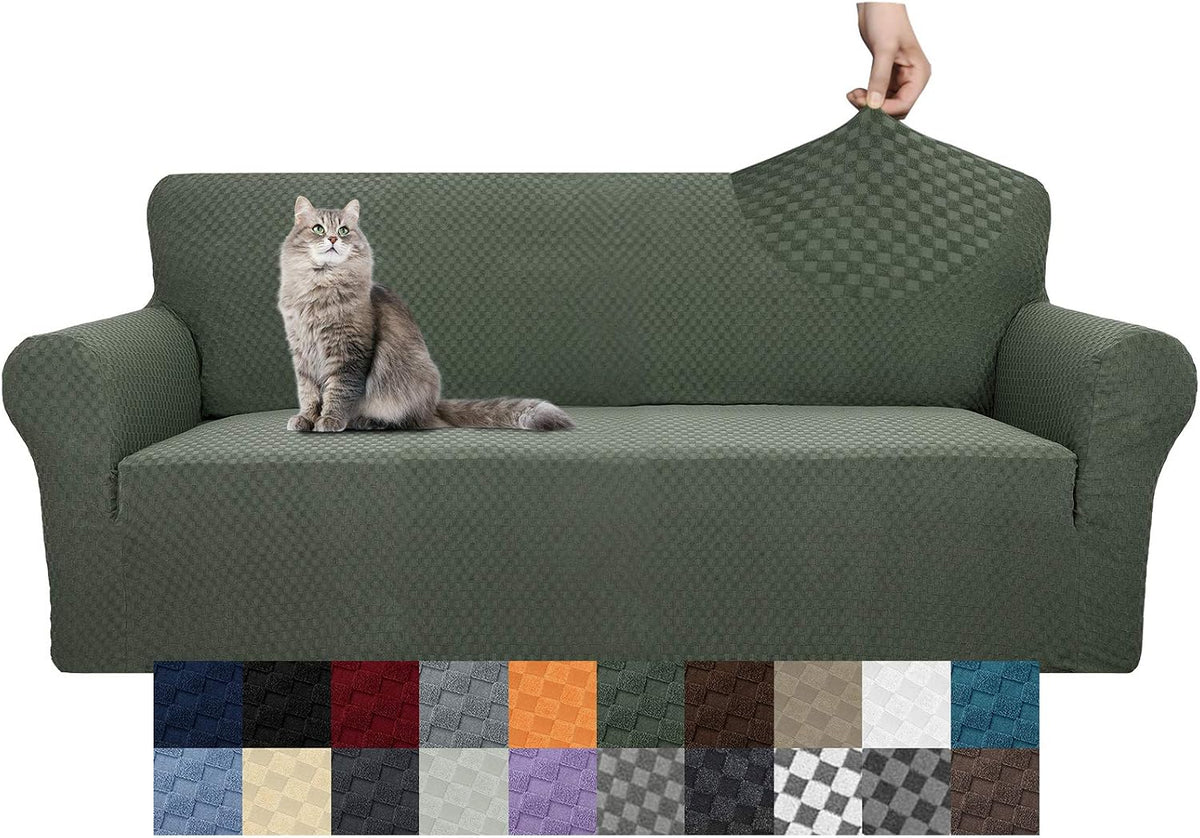 Olive-green textured slipcover on a sofa with a gray cat seated and a hand stretching the back fabric.