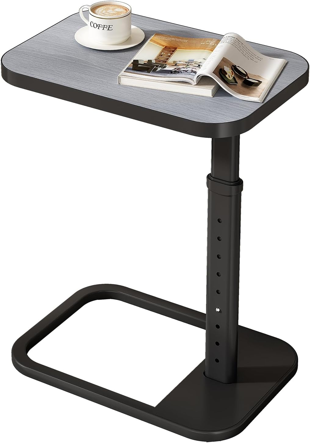 C-shaped end table with light gray wood-grain top, black metal adjustable post and open rectangular C-base with cup and book