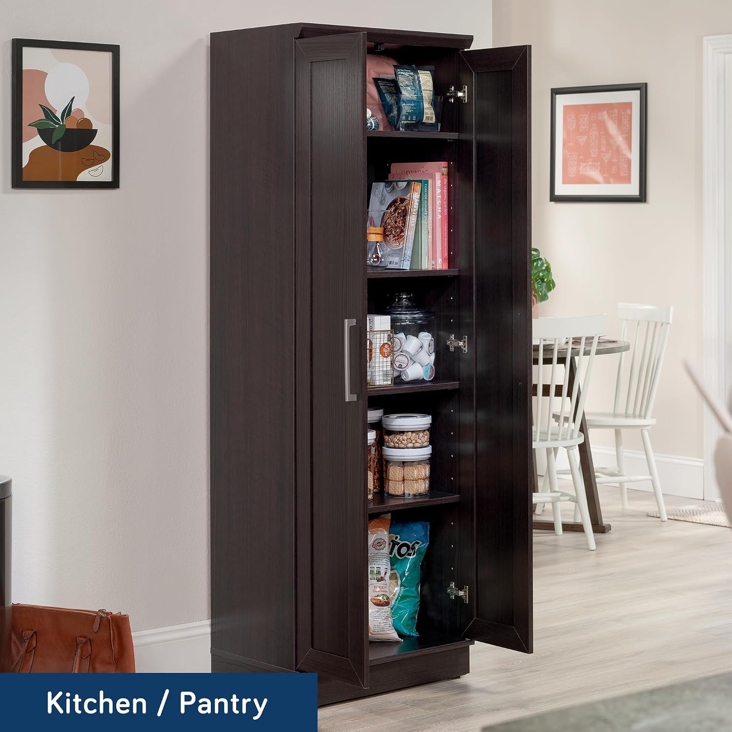Open tall storage cabinet interior view showing four adjustable shelves stocked with pantry items in a kitchen setting.