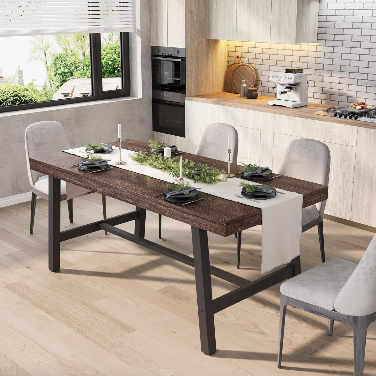 Rectangular dining table with dark brown textured top and black metal trestle base set for six in a kitchen.