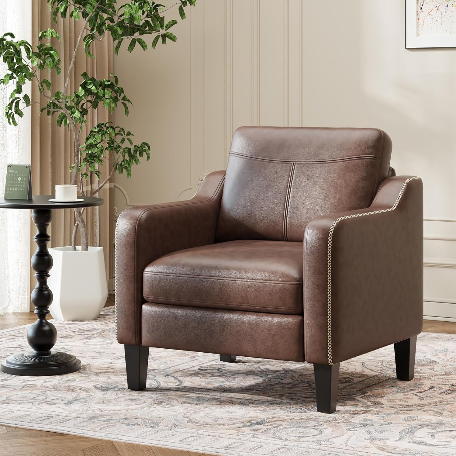 Single brown PU leather accent chair angled front view beside a small round side table