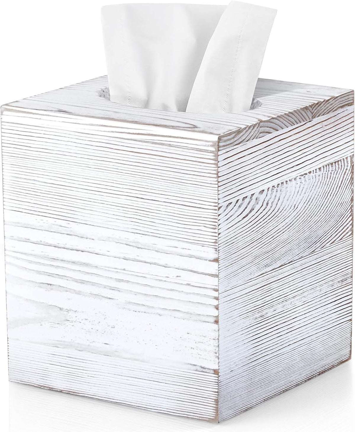 Close-up angled detail of a whitewashed acacia tissue box showing pronounced wood grain and the oval tissue opening.