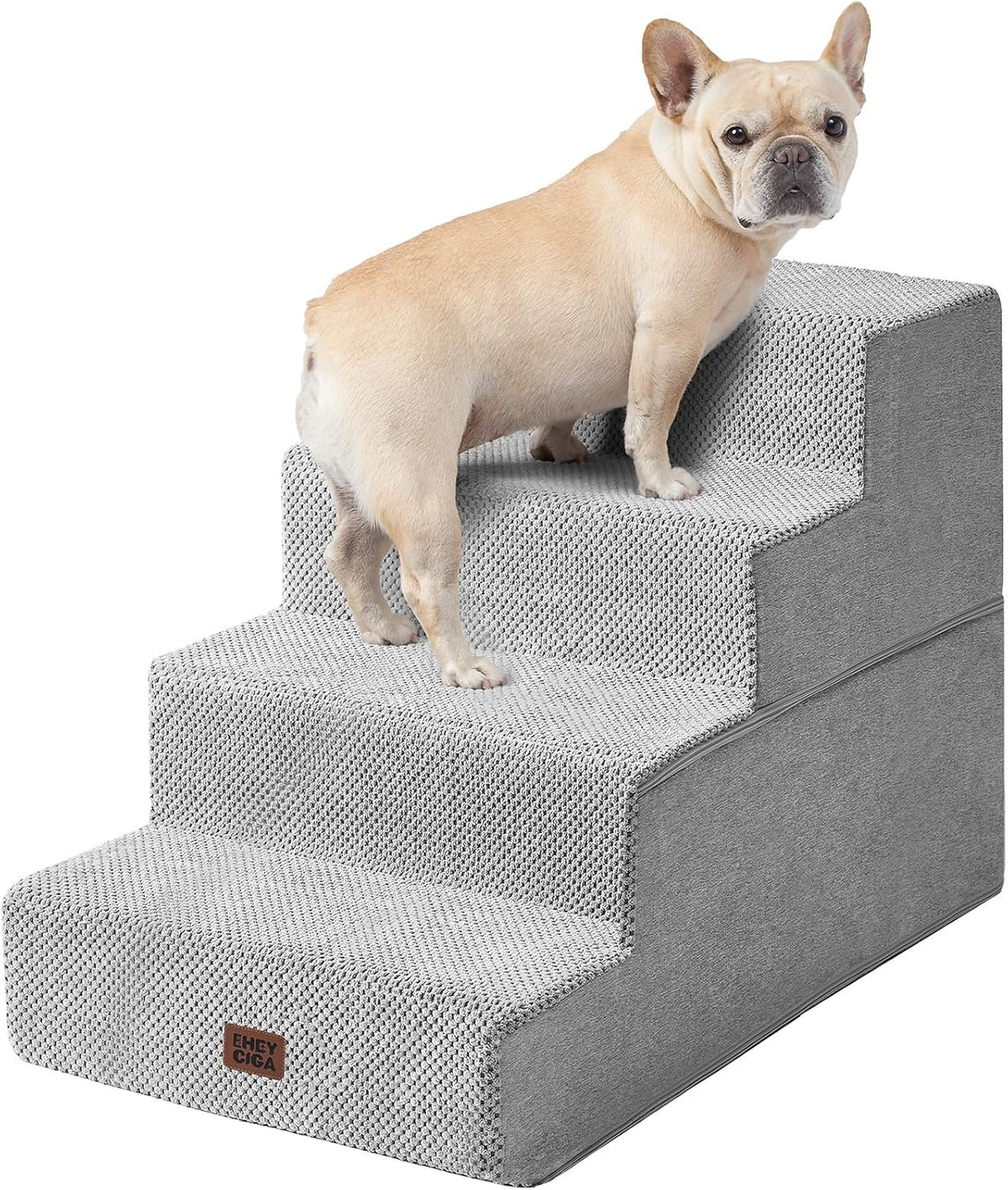 Light gray four-step dog stairs with textured fabric and a small fawn-colored dog on them