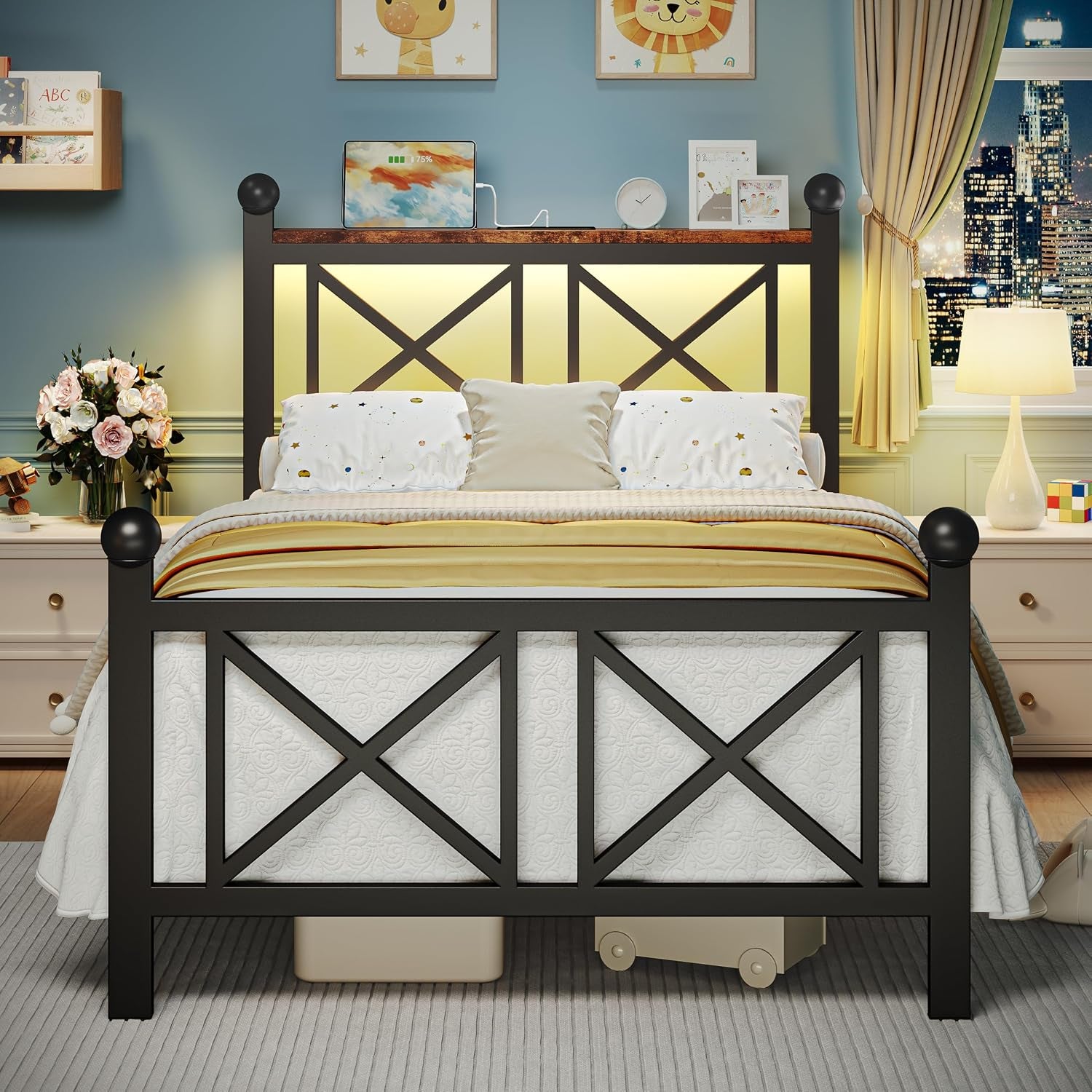 Black platform bed front view with warm yellow LED backlight and storage boxes visible under the frame