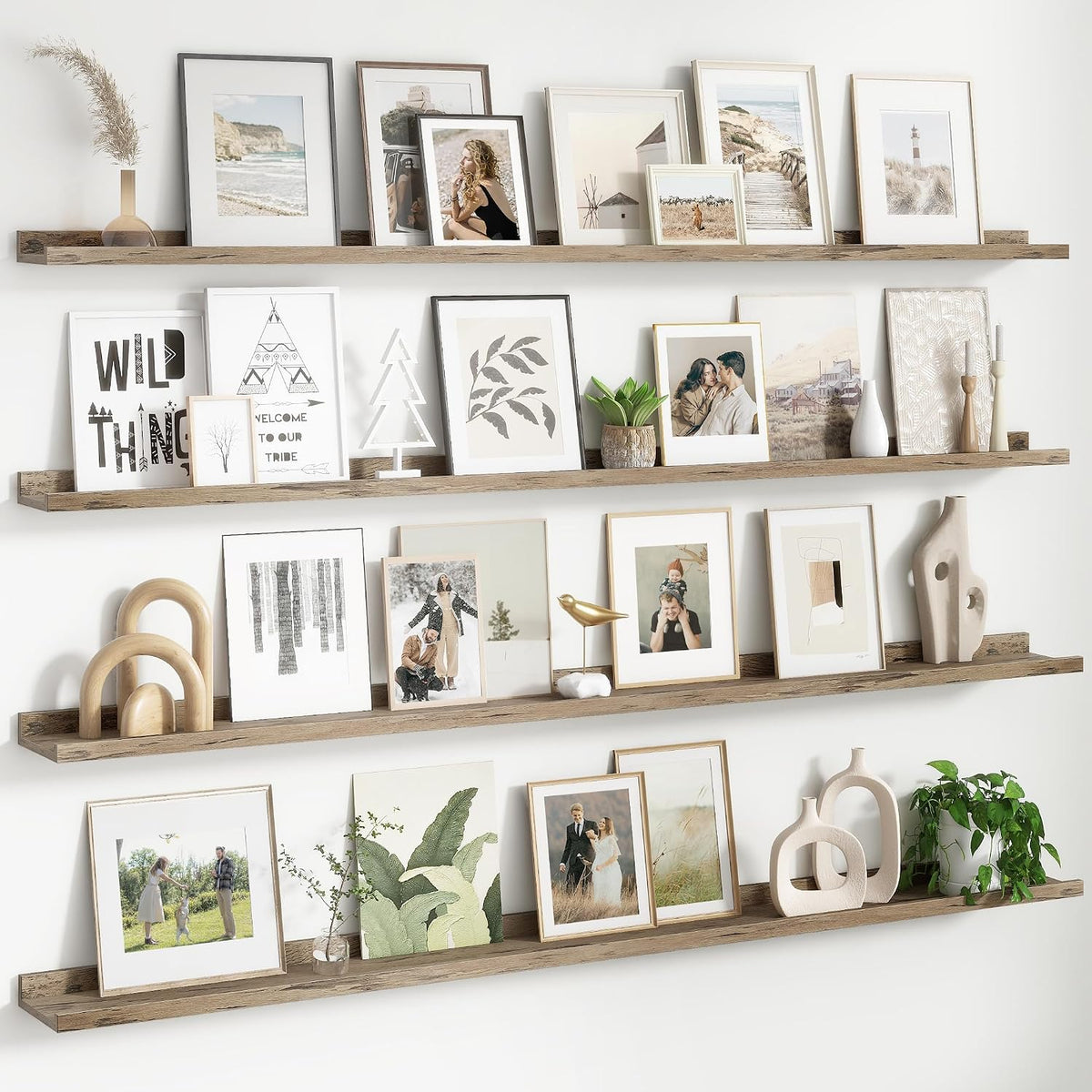 Four staggered rustic wood shelves filled with framed art and decorative objects