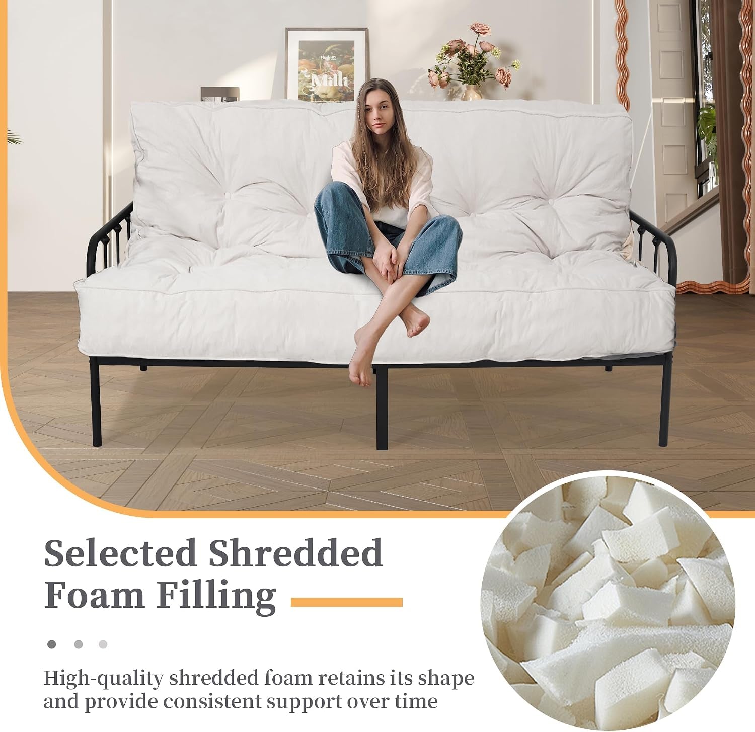 White futon mattress on a metal frame with a person seated, showing tufting and rope edge detail