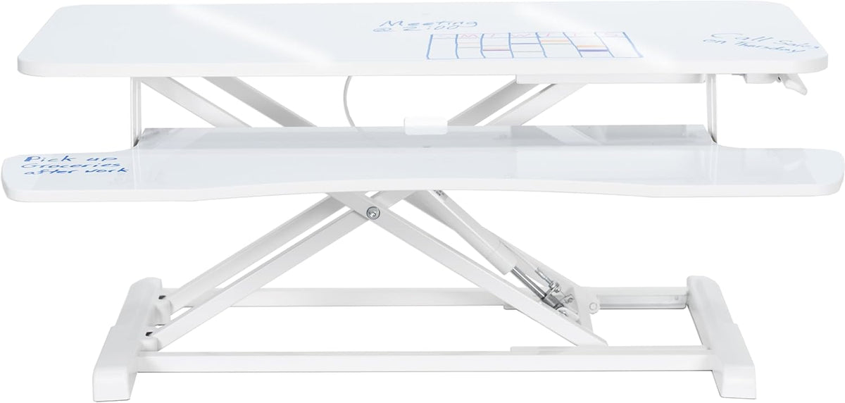 Side profile of a white standing desk converter showing scissor lift mechanism and white keyboard shelf