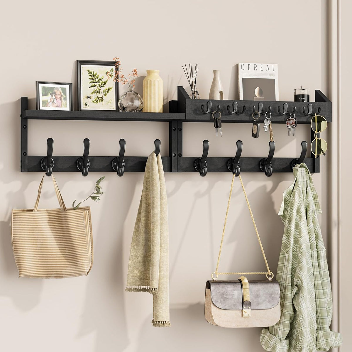 Wall-mounted dark wood coat rack with top shelf, multiple black hooks holding bags, keys and clothes.