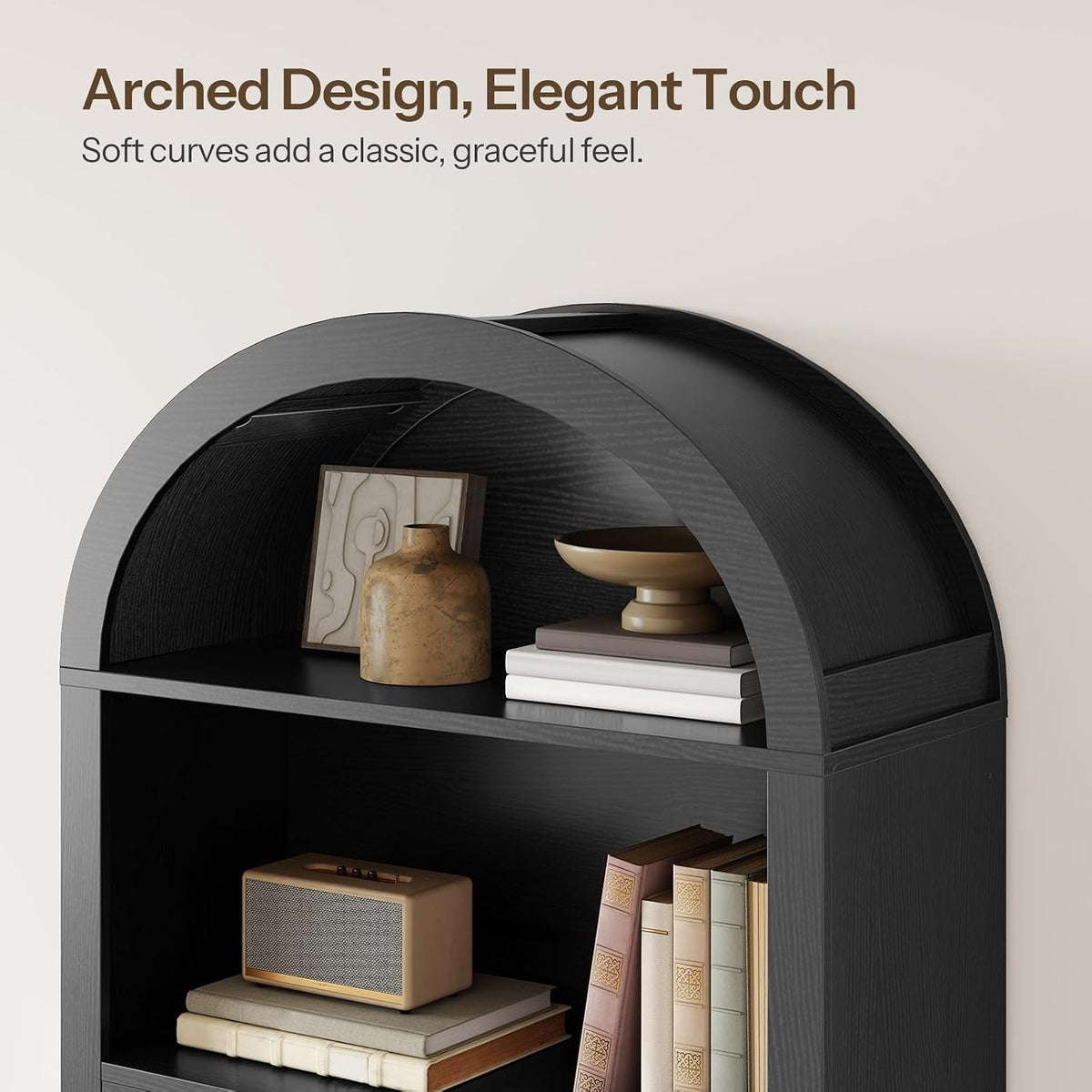Close-up of the bookcase's curved arched top shelf with small decor items on display