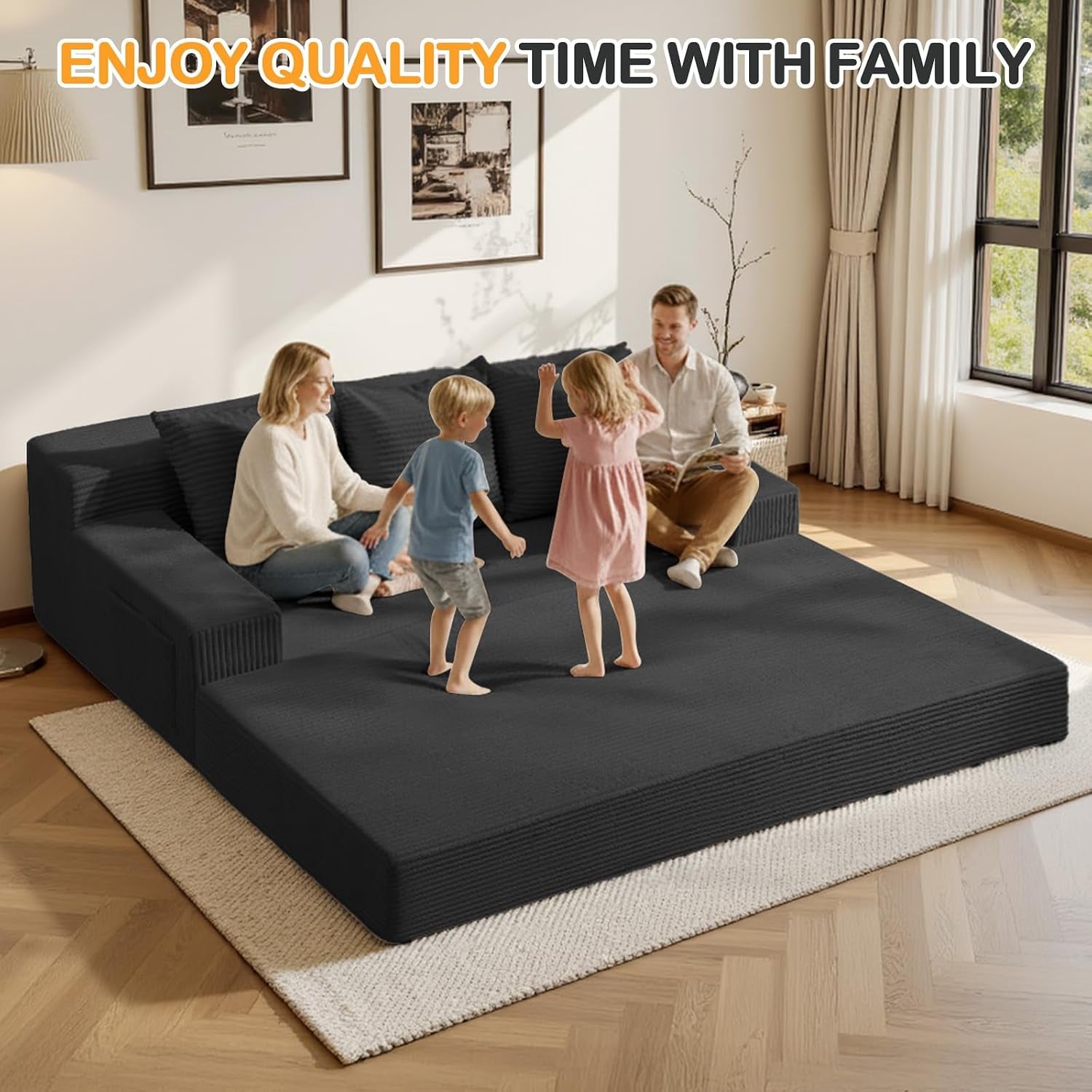 Black sofa converted to low-profile king bed with family sitting and kids playing on the surface