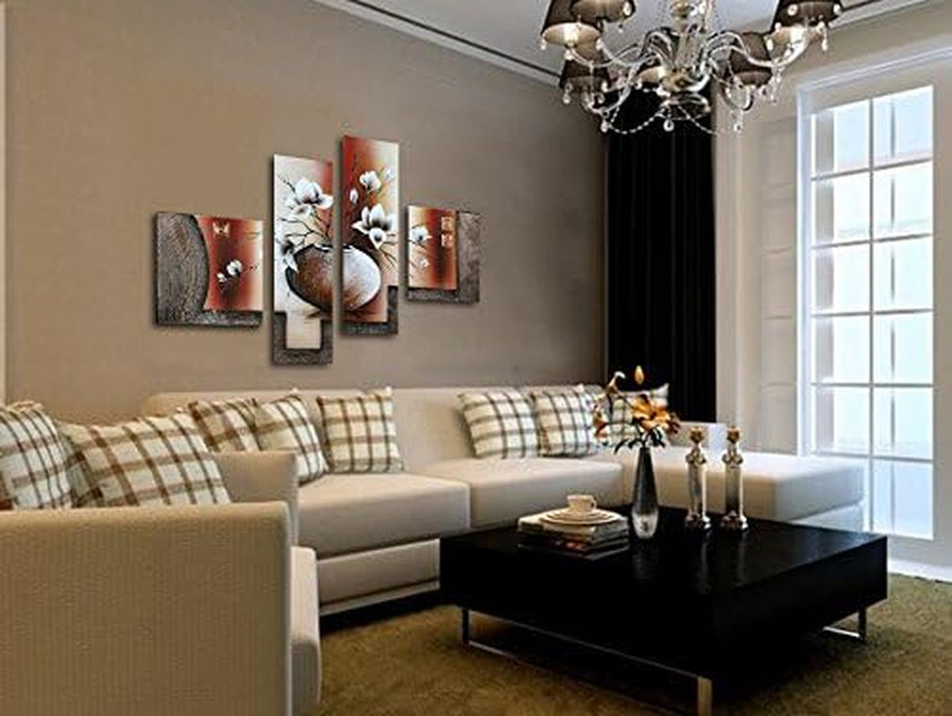 Four-panel canvas displayed above a beige sectional in a warmly lit living room with chandelier and patterned pillows.