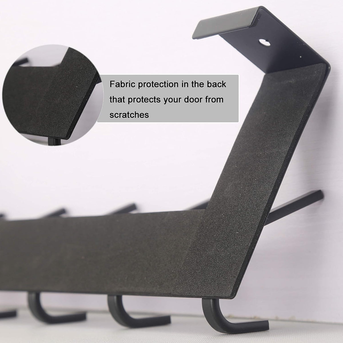 Close detail of the rack's back showing a textured fabric pad covering the metal hanger