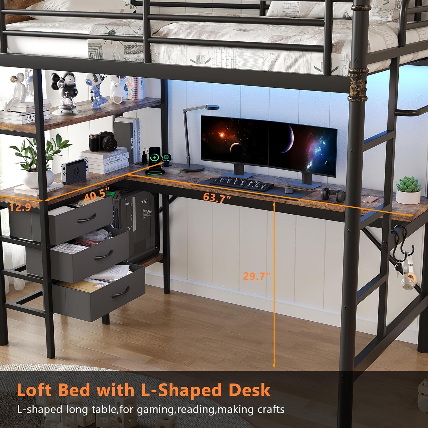 Close view of L-shaped desk under loft with open fabric drawers, dual monitors, gaming PC and ladder at right.