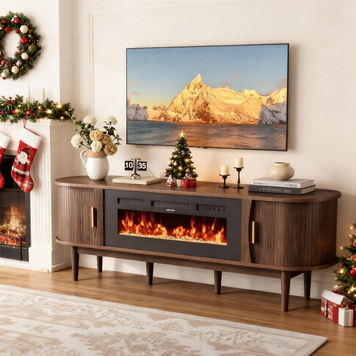 Walnut console decorated for the holidays with small tree, candles and stockings nearby