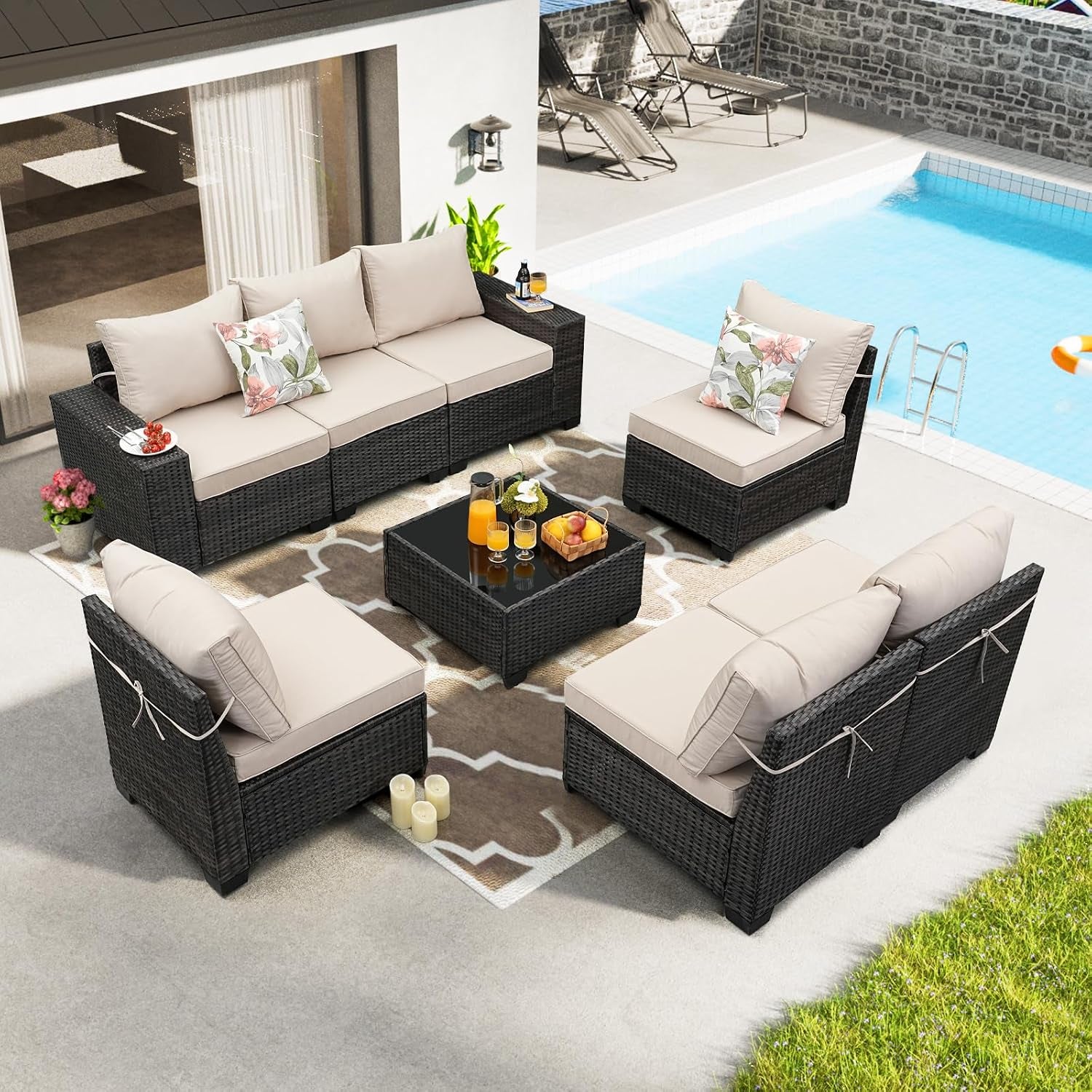 Aerial view of a five-piece dark rattan patio sectional with beige cushions arranged around a glass-top coffee table by a