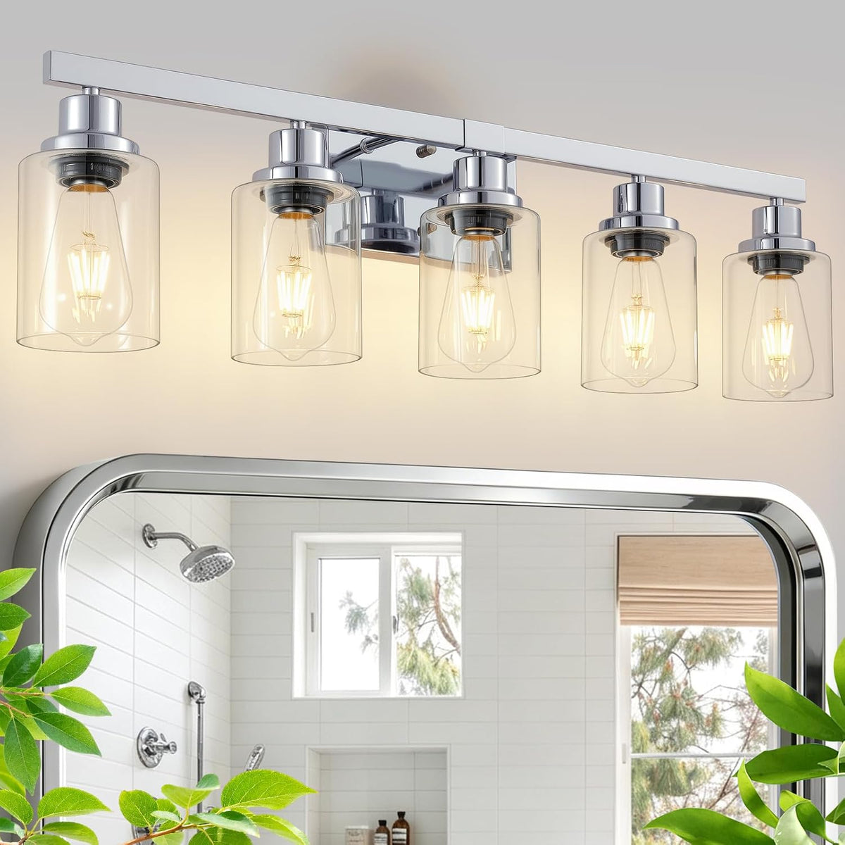 Five-light chrome vanity fixture with clear cylindrical glass shades mounted above a mirror.