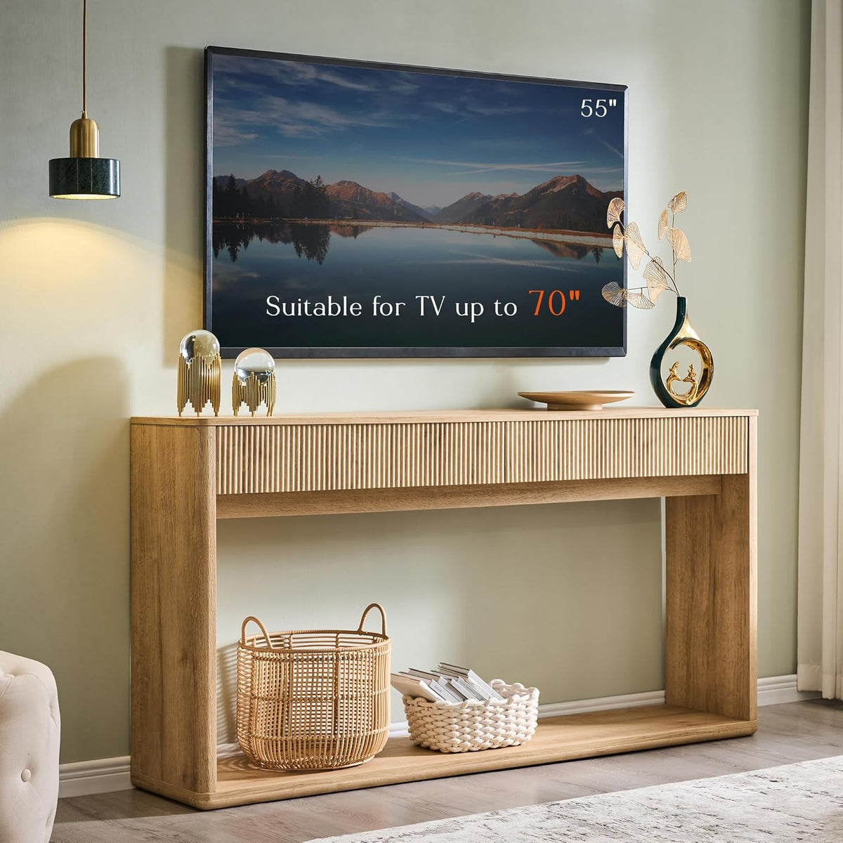 Console placed beneath a wall-mounted TV, topped with decorative vases and baskets on the bottom shelf.