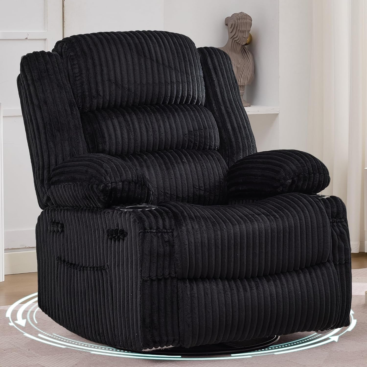 Black corduroy swivel recliner upright in a neutral room with a tall potted plant and shelf art.