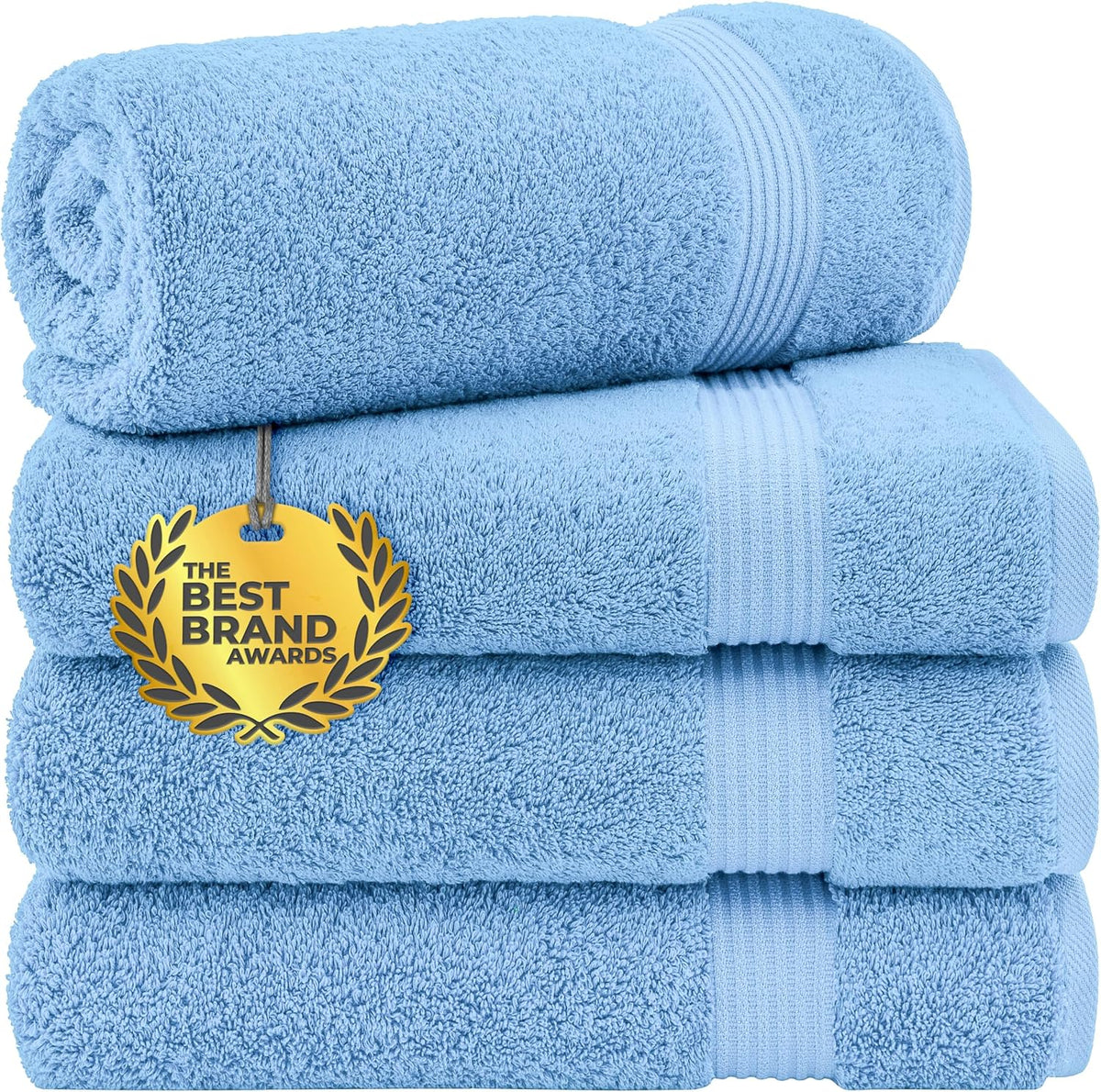 Neatly stacked light blue towels with a gold award medallion tag hanging on the front