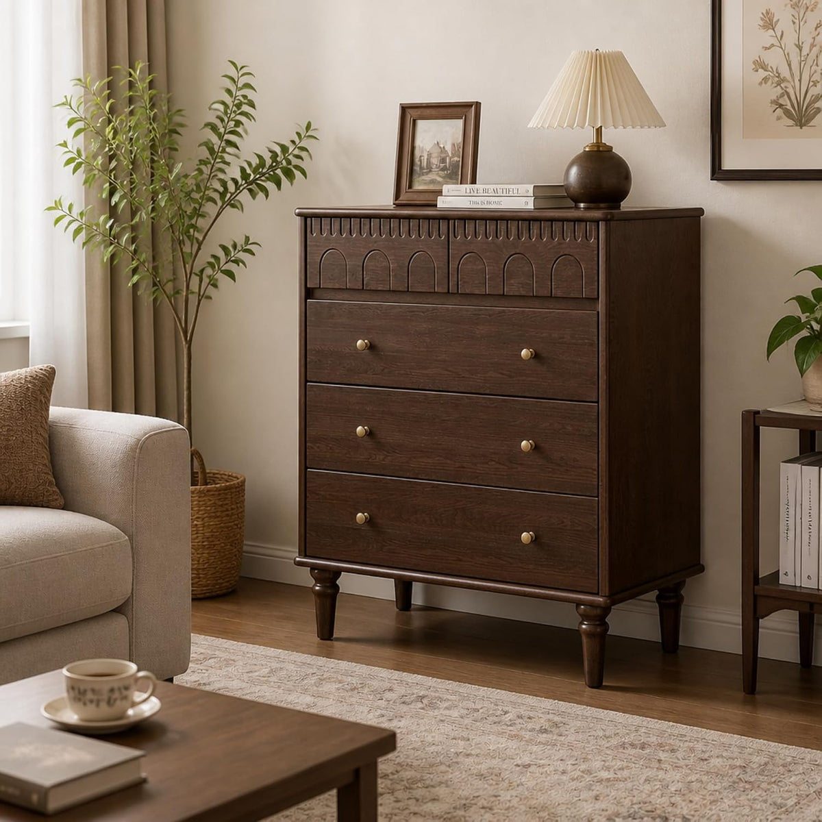Dark wood five-drawer dresser in a living area with lamp, framed art, and a potted plant.